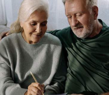 Older couple looking at financial savings