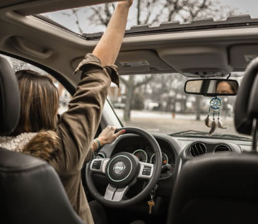 Lady driving her new automobile