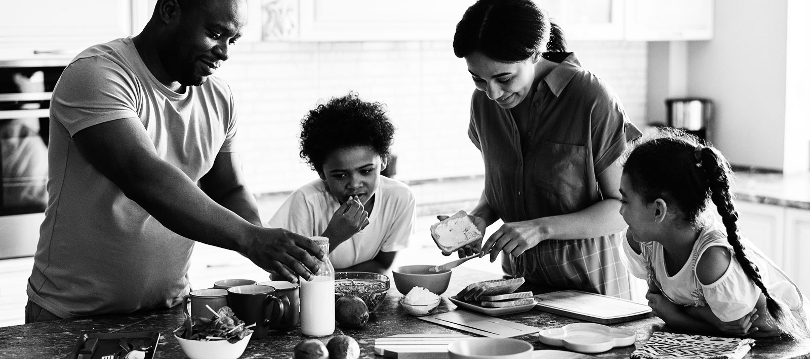 Family preparing a meal in their home