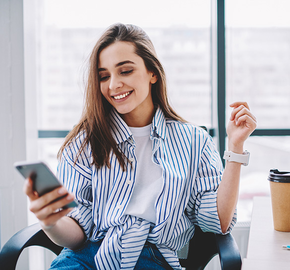 Lady using a smartphone in her office